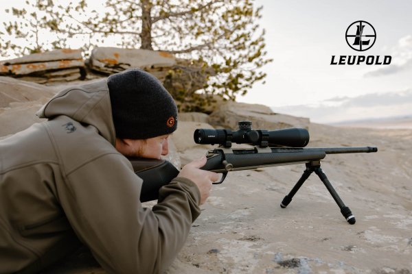 wtar-0024-gunwerks-rifle-with-scope-rock-outcrop-prone-leupold-logo